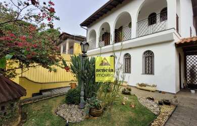 Imagem: A casa possui 3 Dormitórios, 5 Banheiros, 5 Vagas na garagem