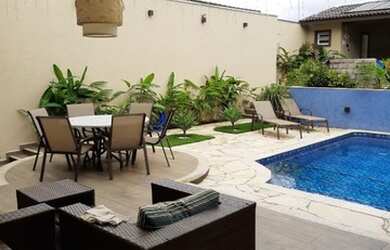 Imagem: A casa possui 4 Dormitórios, 3 Banheiros, 4 Vagas na garagem