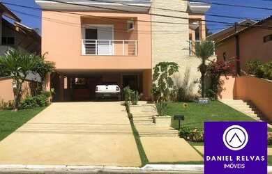 Imagem: A casa possui 5 Dormitórios, 5 Banheiros, 4 Vagas na garagem