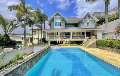 Imagem: A casa em condomínio possui 4 Dormitórios, 5 Banheiros, 5