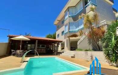 Imagem: A casa possui 4 Dormitórios, 4 Banheiros, 5 Vagas na garagem