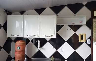 Imagem: A casa possui 3 Dormitórios, 2 Banheiros e está localizado