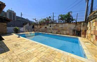 Imagem: A casa e possui 5 Dormitórios, Suítes, 4 Banheiros, 5 Vagas