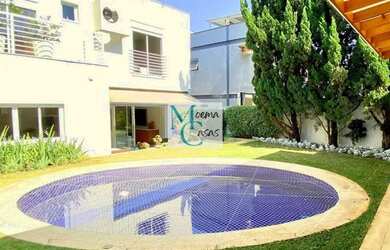 Imagem: A casa possui 4 Dormitórios, 5 Banheiros, 2 Vagas na garagem