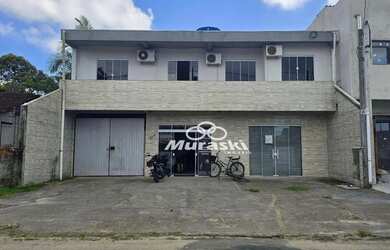 Imagem: A casa possui 4 Dormitórios, 5 Banheiros, 4 Vagas na garagem