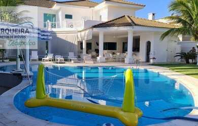 Imagem: A casa possui 5 Dormitórios, 5 Banheiros, 4 Vagas na garagem