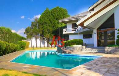 Imagem: A casa possui 5 Dormitórios, 5 Banheiros, 5 Vagas na garagem