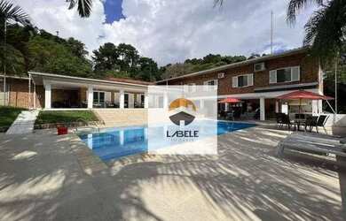 Imagem: A casa em condomínio possui 5 Dormitórios, 5 Banheiros, 5