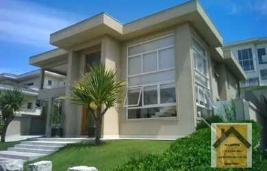 Imagem: A casa possui 4 Dormitórios, 5 Banheiros, 5 Vagas na garagem