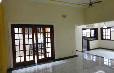 Imagem: A casa possui 3 Dormitórios, 4 Banheiros, 3 Vagas na garagem