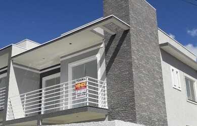 Imagem: A casa possui 3 Dormitórios, 2 Banheiros, 1 Vaga na garagem