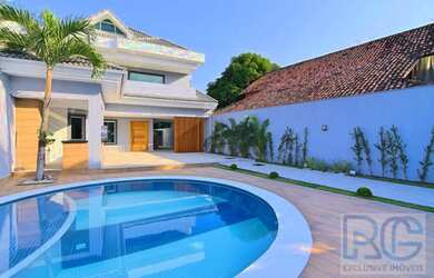 Imagem: A casa em condomínio possui 4 Dormitórios, 5 Banheiros, 4