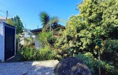 Imagem: A casa possui 3 Dormitórios, 3 Banheiros, 2 Vagas na garagem