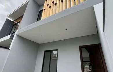 Imagem: A casa possui 3 Dormitórios, 1 Banheiro, 2 Vagas na garagem