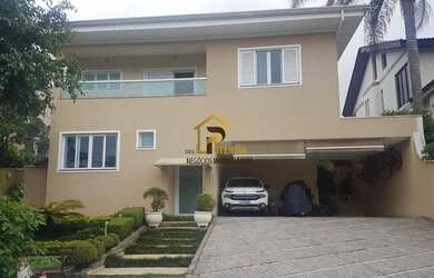 Imagem: A casa possui 4 Dormitórios, 5 Banheiros, 3 Vagas na garagem