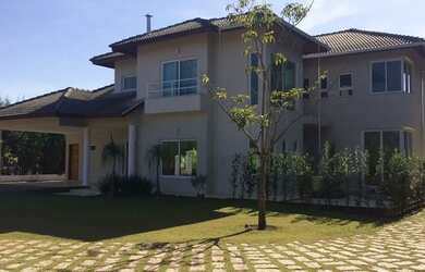 Imagem: A casa em condomínio possui 5 Dormitórios, 5 Banheiros, 5