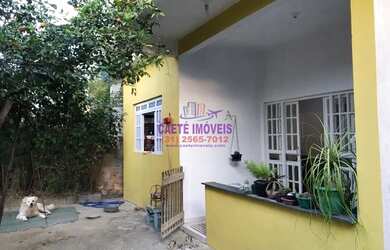 Imagem: A casa possui 5 Dormitórios, 2 Banheiros, 4 Vagas na garagem