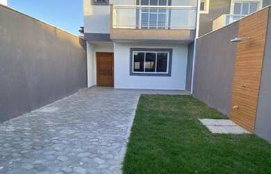 Imagem: A casa possui 3 Dormitórios, 3 Banheiros, 2 Vagas na garagem