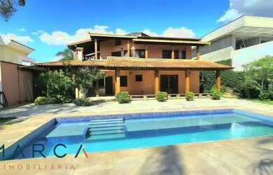 Imagem: A casa possui 5 Dormitórios, 5 Banheiros, 4 Vagas na garagem