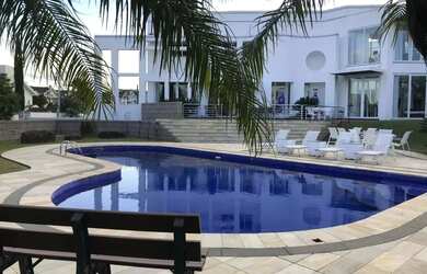 Imagem: A casa possui 5 Dormitórios, 5 Banheiros, 5 Vagas na garagem