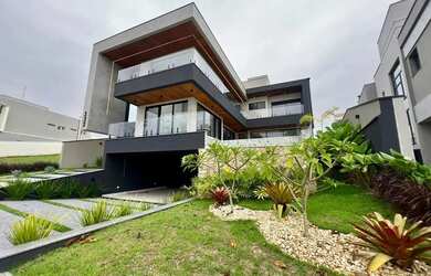 Imagem: A casa possui 5 Dormitórios, 5 Banheiros, 4 Vagas na garagem