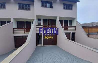 Imagem: A casa possui 2 Dormitórios, 2 Banheiros, 3 Vagas na garagem