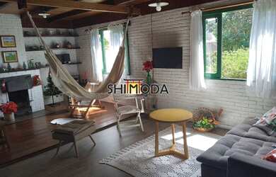 Imagem: A casa possui 4 Dormitórios, 4 Banheiros, 4 Vagas na garagem