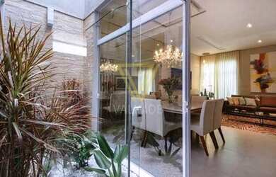 Imagem: A casa possui 3 Dormitórios, 3 Banheiros, 4 Vagas na garagem