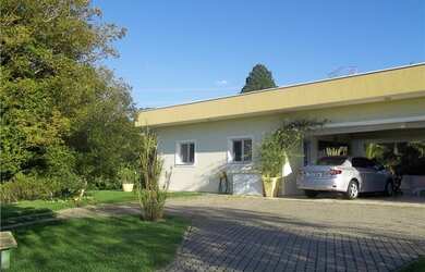 Imagem: A casa em condomínio à venda possui 4 Dormitórios, 5 Banheiros