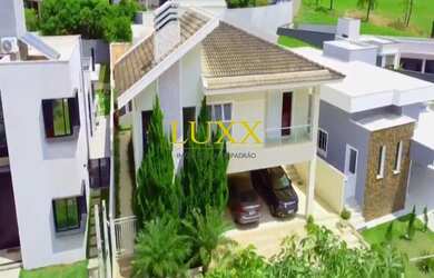 Imagem: A casa possui 3 Dormitórios, 5 Banheiros, 5 Vagas na garagem