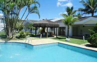 Imagem: A casa possui 5 Dormitórios, 5 Banheiros, 5 Vagas na garagem