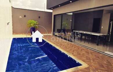 Imagem: A casa possui 3 Dormitórios, 4 Banheiros, 5 Vagas na garagem