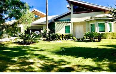 Imagem: A casa em condomínio à venda possui 4 Dormitórios, 5 Banheiros