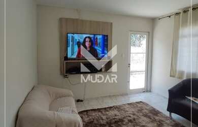 Imagem: A casa possui 4 Dormitórios, 2 Banheiros, 2 Vagas na garagem