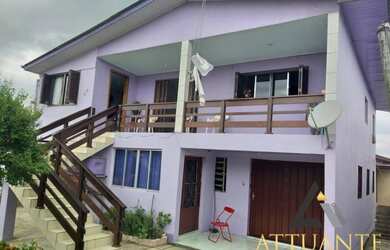 Imagem: A casa possui 4 Dormitórios, 4 Banheiros, 2 Vagas na garagem