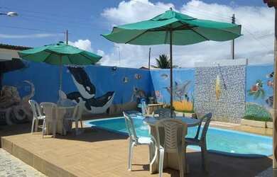 Imagem: A casa possui 4 Dormitórios, 5 Vagas na garagem e está localizado