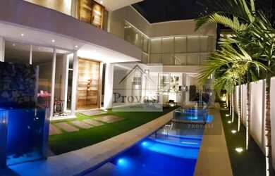 Imagem: A casa possui 3 Dormitórios, 5 Banheiros, 5 Vagas na garagem