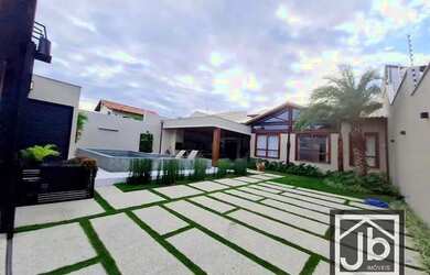 Imagem: A casa possui 4 Dormitórios, 5 Banheiros, 2 Vagas na garagem