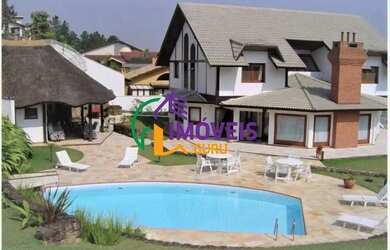 Imagem: A casa em condomínio possui 4 Dormitórios, 5 Banheiros, 3