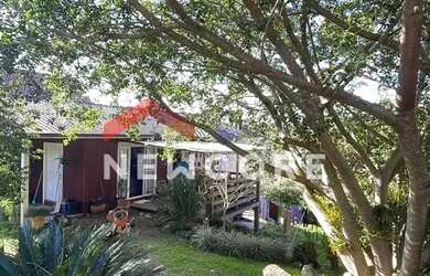 Imagem: A casa possui 5 Dormitórios, 2 Banheiros, 2 Vagas na garagem