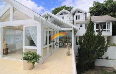 Imagem: A casa possui 3 Dormitórios, 5 Banheiros, 5 Vagas na garagem