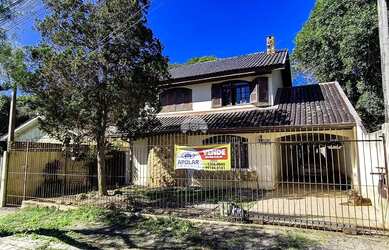 Imagem: A casa possui 3 Dormitórios, 5 Banheiros, 5 Vagas na garagem