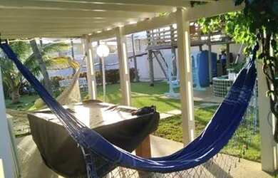 Imagem: A casa possui 4 Dormitórios, 2 Banheiros, 2 Vagas na garagem