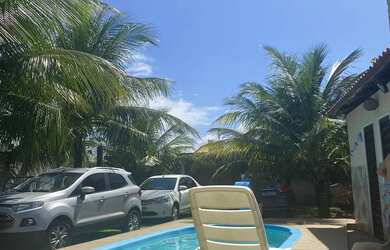 Imagem: A casa possui 4 Dormitórios, 4 Banheiros, 4 Vagas na garagem