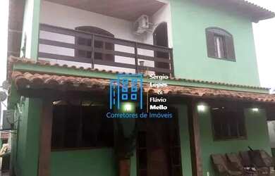 Imagem: A casa possui 4 Dormitórios, 2 Banheiros, 3 Vagas na garagem