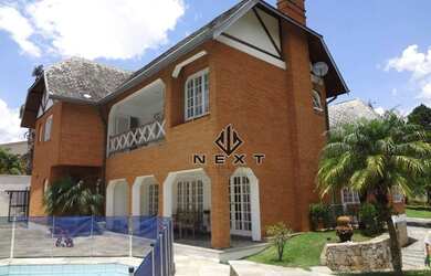 Imagem: A casa em condomínio possui 4 Dormitórios, 5 Banheiros, 4