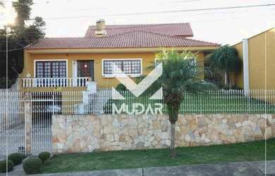 Imagem: A casa possui 3 Dormitórios, 4 Banheiros, 3 Vagas na garagem