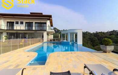 Imagem: A casa em condomínio possui 5 Dormitórios, 5 Banheiros, 5