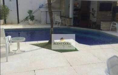 Imagem: A casa em condomínio possui 5 Dormitórios, 5 Banheiros, 2