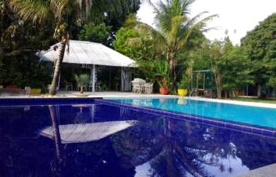 Imagem: A casa possui 4 Dormitórios, 4 Banheiros, 5 Vagas na garagem